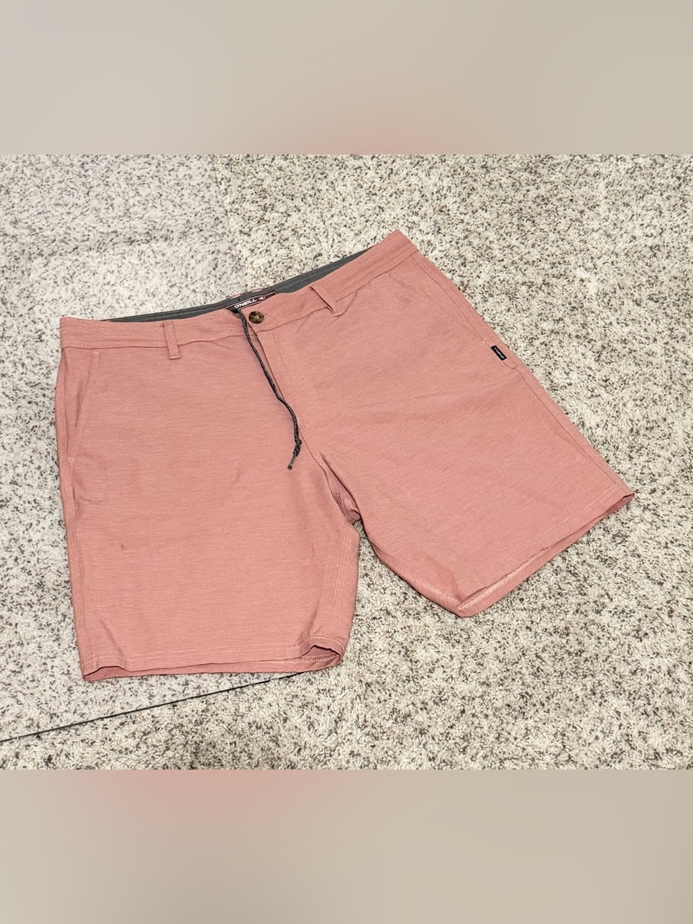 Men’s O'Neill Reserve Light Check Hybrid Shorts in a coral or rose color 36
